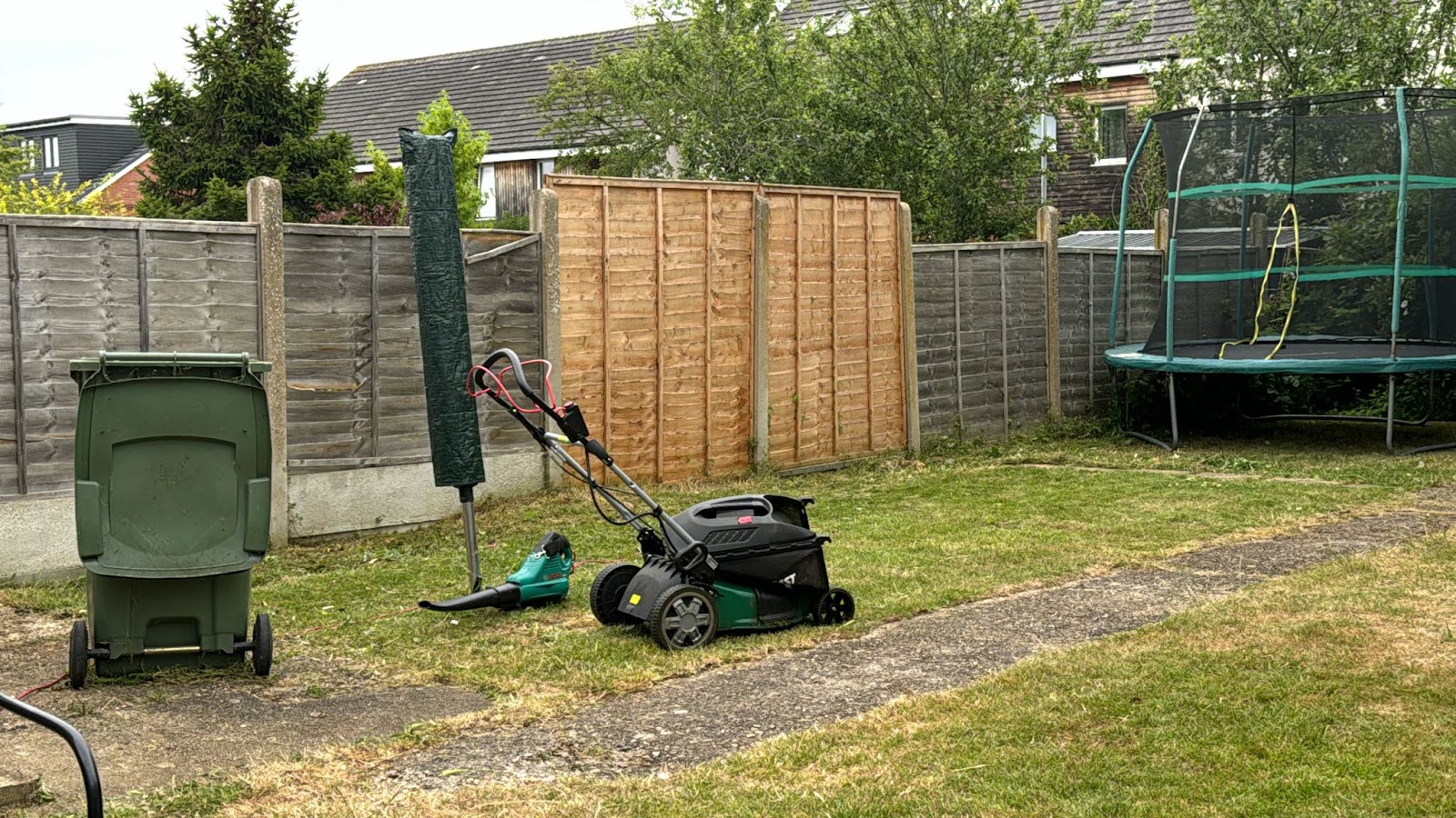 A back garden with the lawn cut and a new fence, tidied after works