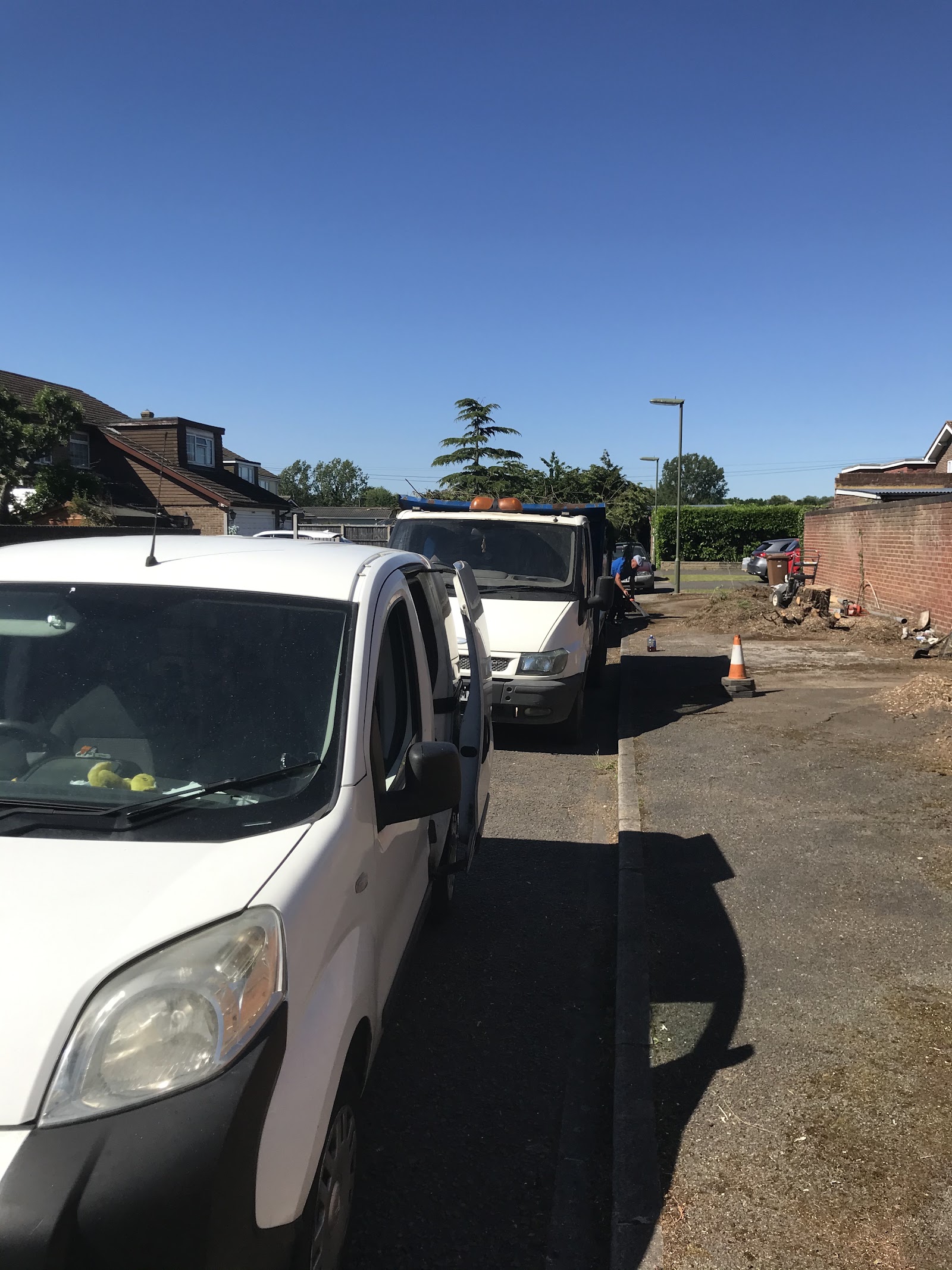 Heartwood vehicles on site during a job on a residential street